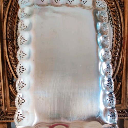 Metal serving platter used with beautiful decoration for desserts