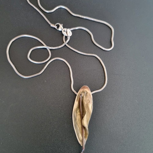 Silver handmade jewelry used with mixed materials leaf design