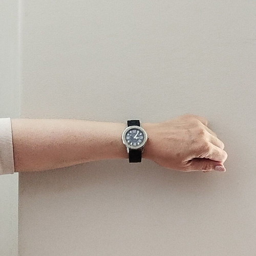 Newman watch used with blue dial and white crystals