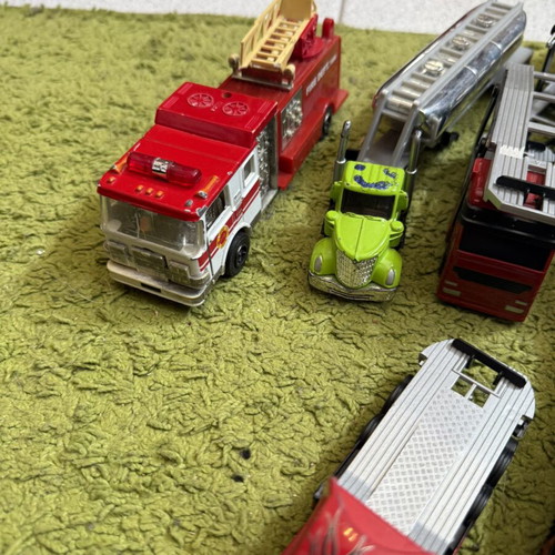 Large collection of toy trucks with accessories
