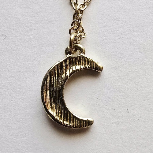 Necklace new, gold color with crescent moon pendant