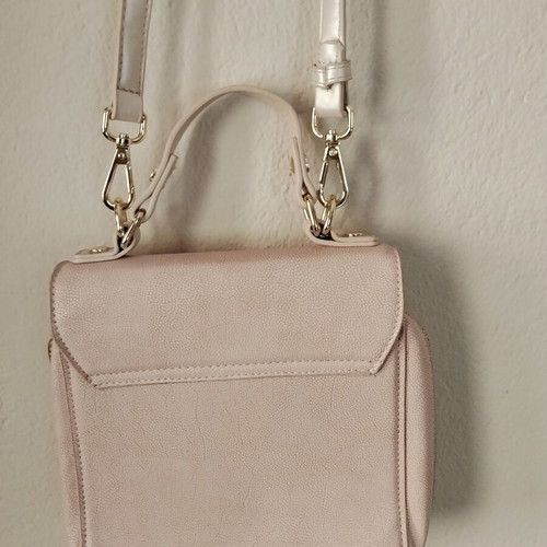 Axel pink shoulder bag used with gold details