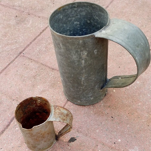 Vintage metal water and oil measuring cups used, set of two