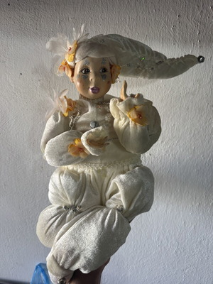 Decorative doll with winding mechanism