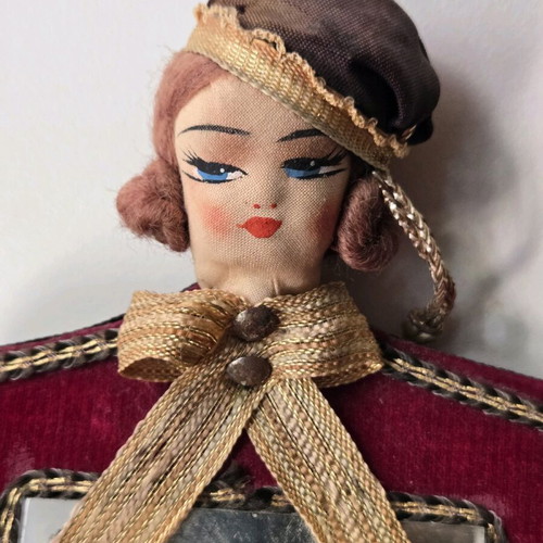 Antique mirror with velvet frame and doll, used 1950-1965