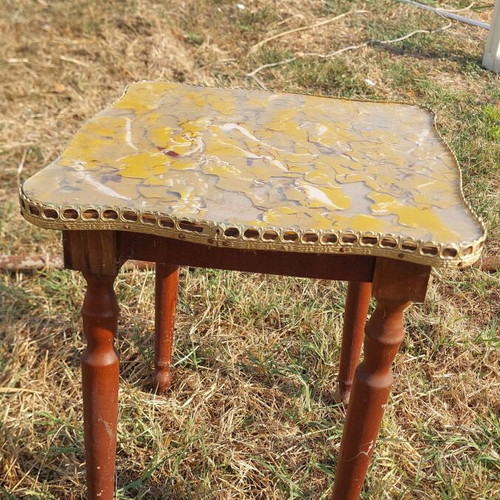 Vintage handmade wooden table with decorative surface