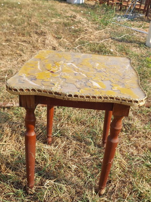 Vintage handmade wooden table with decorative surface
