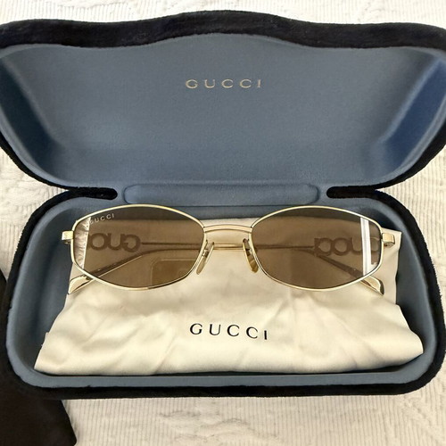 Gucci women's sunglasses GG1802S 005 with gold metal frame and brown lenses new