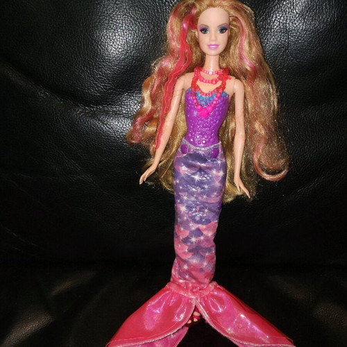 Barbie mermaid doll used with secret door