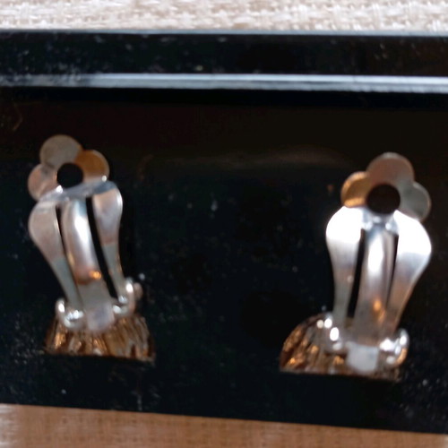 Clip-on earrings new, silver sun design
