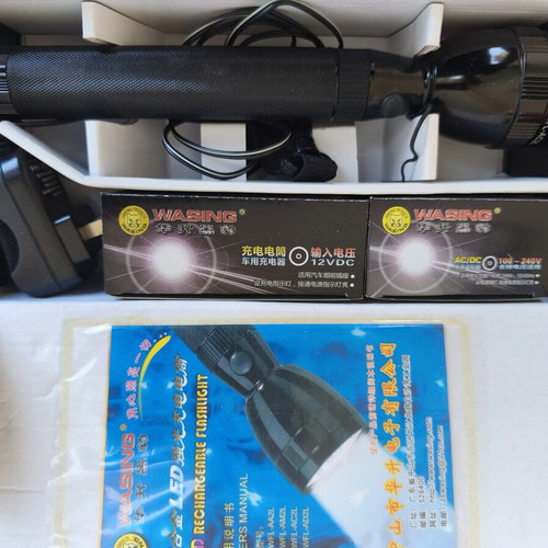 Flashlight new with rechargeable batteries and dual voltage