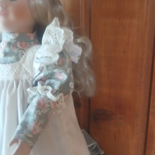Porcelain doll like new with vintage lace dress and floral details