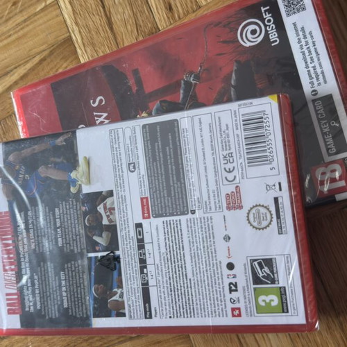 Nintendo Switch 2 games package NBA 2K26 and Assassin's Creed Shadows, sealed