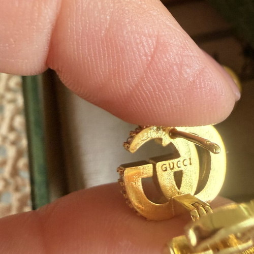 Gucci Double G gold tone earrings 2 in 1