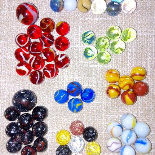 Set of 68 glass marbles used with collectible designs and 2 large shooters