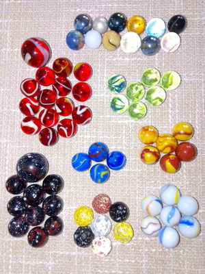 Set of 68 glass marbles used with collectible designs and 2 large shooters