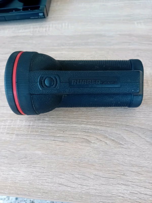 Handheld flashlight used