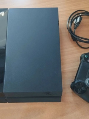 Sony PlayStation 4 Fat 500GB console with DualShock controller