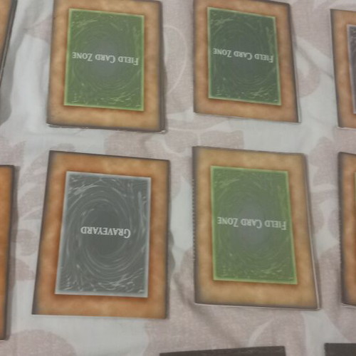 Yu-Gi-Oh! rule books and deck zones, like new, set of 14 each