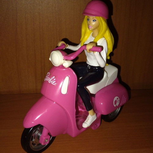 Barbie figure on motorcycle used with motion