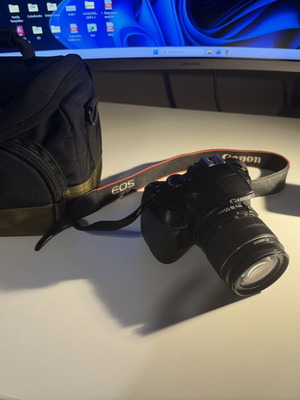 Canon EOS 1300D DSLR camera with 18-55mm and 50mm 1.8 STM lenses used