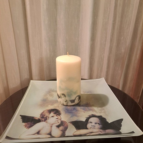 Plate with angels and used candle