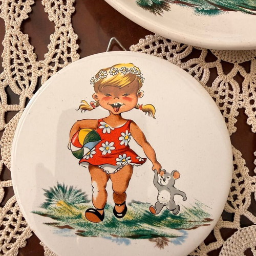 Ceramic vintage plates with children's figures used
