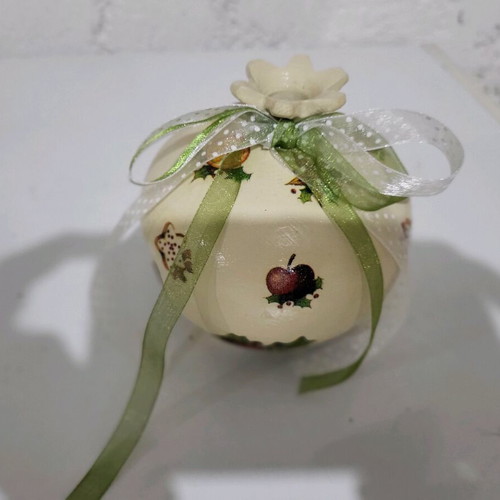 Christmas pomegranate new decorated with ribbons and decoupage