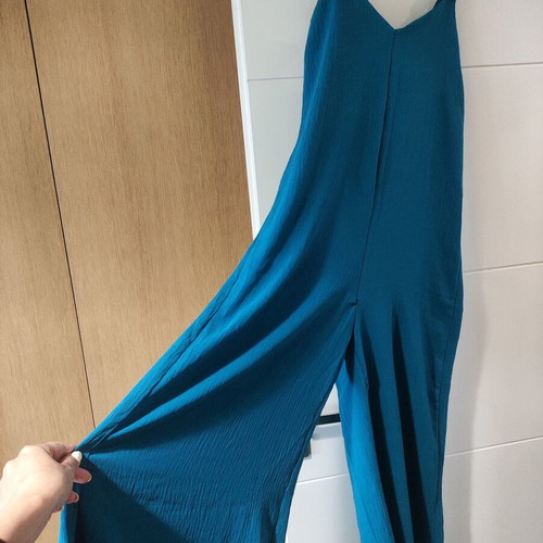 Jumpsuit like new with gold detail on straps, turquoise color