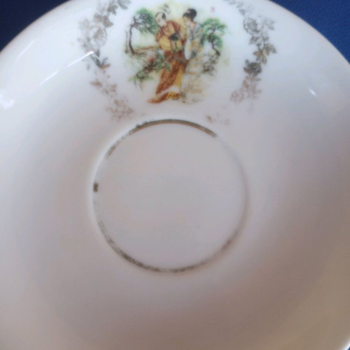 Porcelain vintage plates used, set of two with gold details