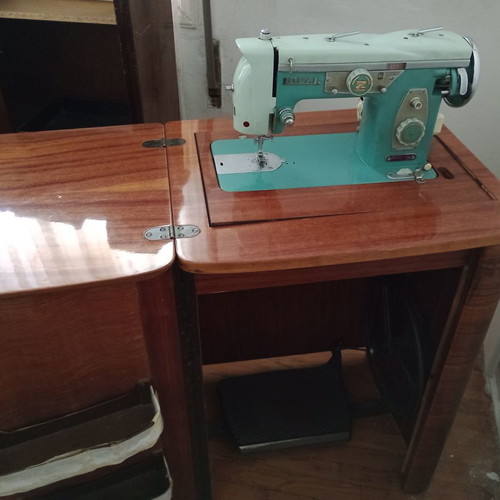 Ideal sewing machine used, foot-powered with motor, wooden cabinet