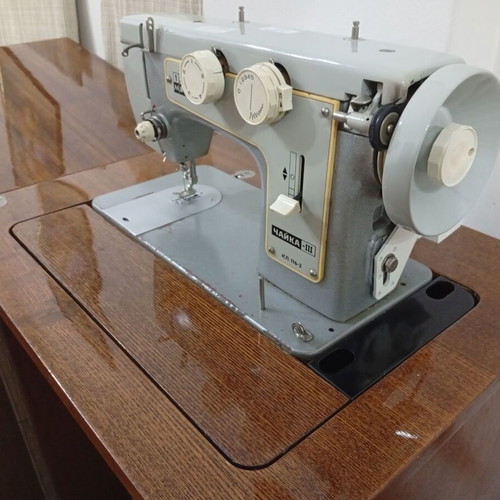 Russian Chaika Sewing Machine used with cabinet and accessories