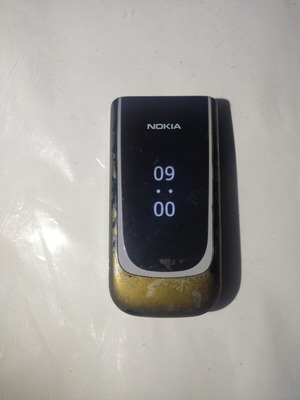 Nokia 7020 used, gray color with clock