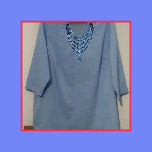 Light blue blouse with decorative neckline