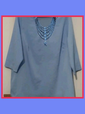 Light blue blouse with decorative neckline