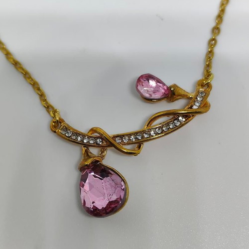Pendant with pink crystals and gold chain like new