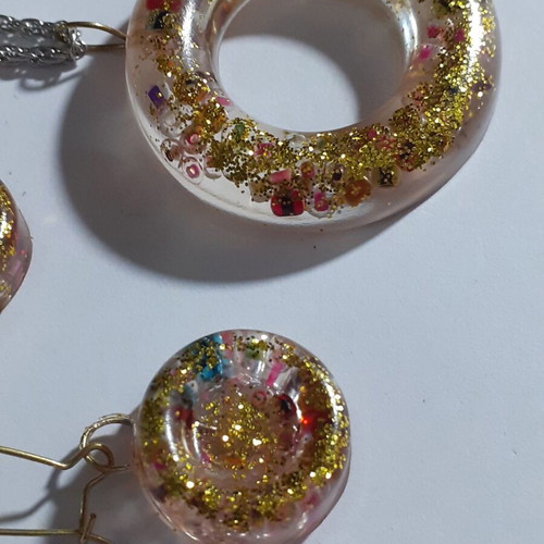 Two sets of handmade pendants and earrings, multicolor