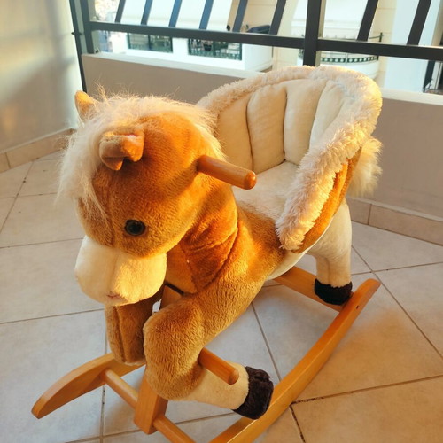 Wooden rocking horse like new with plush carriage