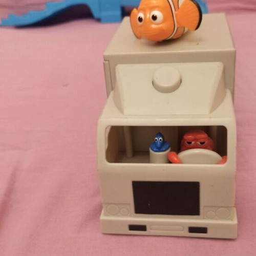 Educational toy set like new with learning board, dragon figure, animal cubes, and Nemo truck
