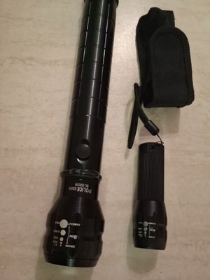 Large and small flashlight like new, large with batteries