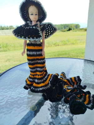 70s doll with handmade knitted clothes and metal stand