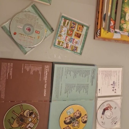 Large pack of children's books and music CDs with stories, songs, poems