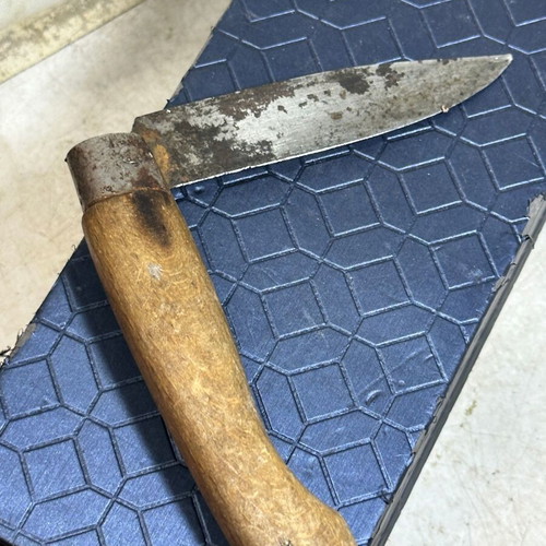 Vintage folding pocket knife with wooden handle used