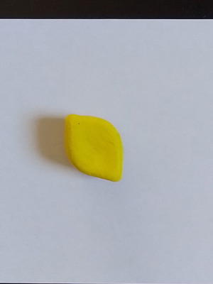 Handmade lemon magnet from clay