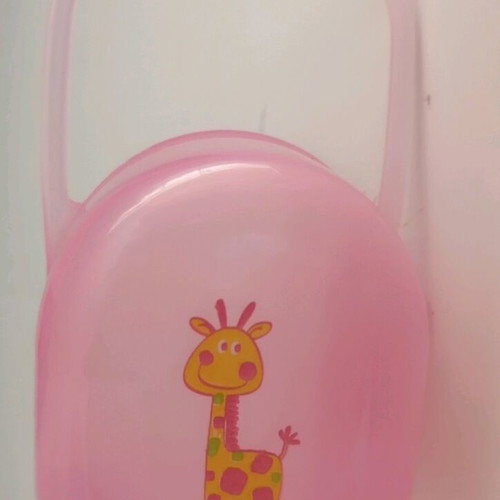 Plastic pacifier case used, pink with giraffe design