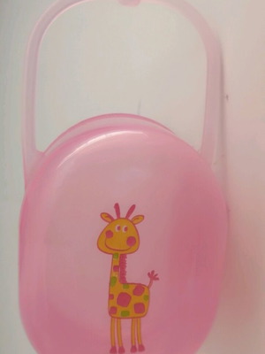 Plastic pacifier case used, pink with giraffe design