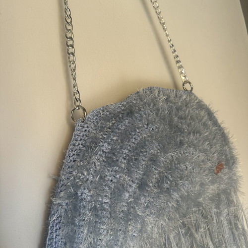 Handmade knitted shoulder bag turquoise with fringes and fluffy texture