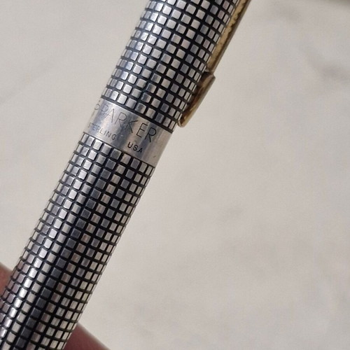 Parker pen in like new condition, possibly silver or silver-plated
