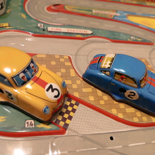 Race track toy with 3 wind-up cars used, 1960, metal