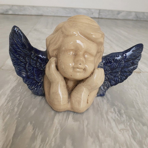 Ceramic angel used